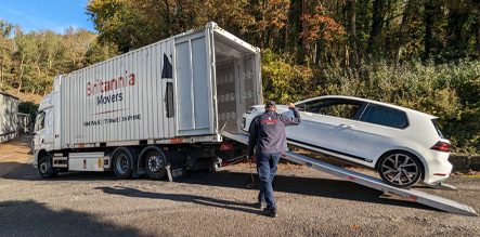 loading car into moving vehicle